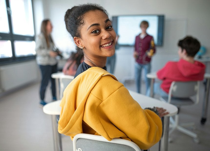Students in a classroom using music-powered English lessons